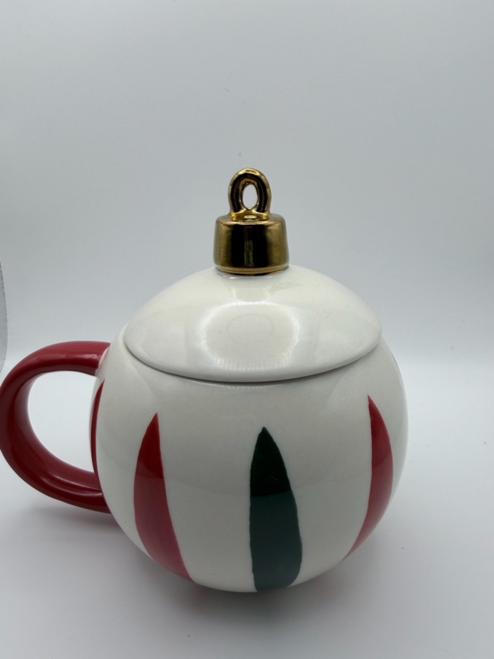 White Ceramic Holiday Ornament Mug with Gold Lid and Red Handle
